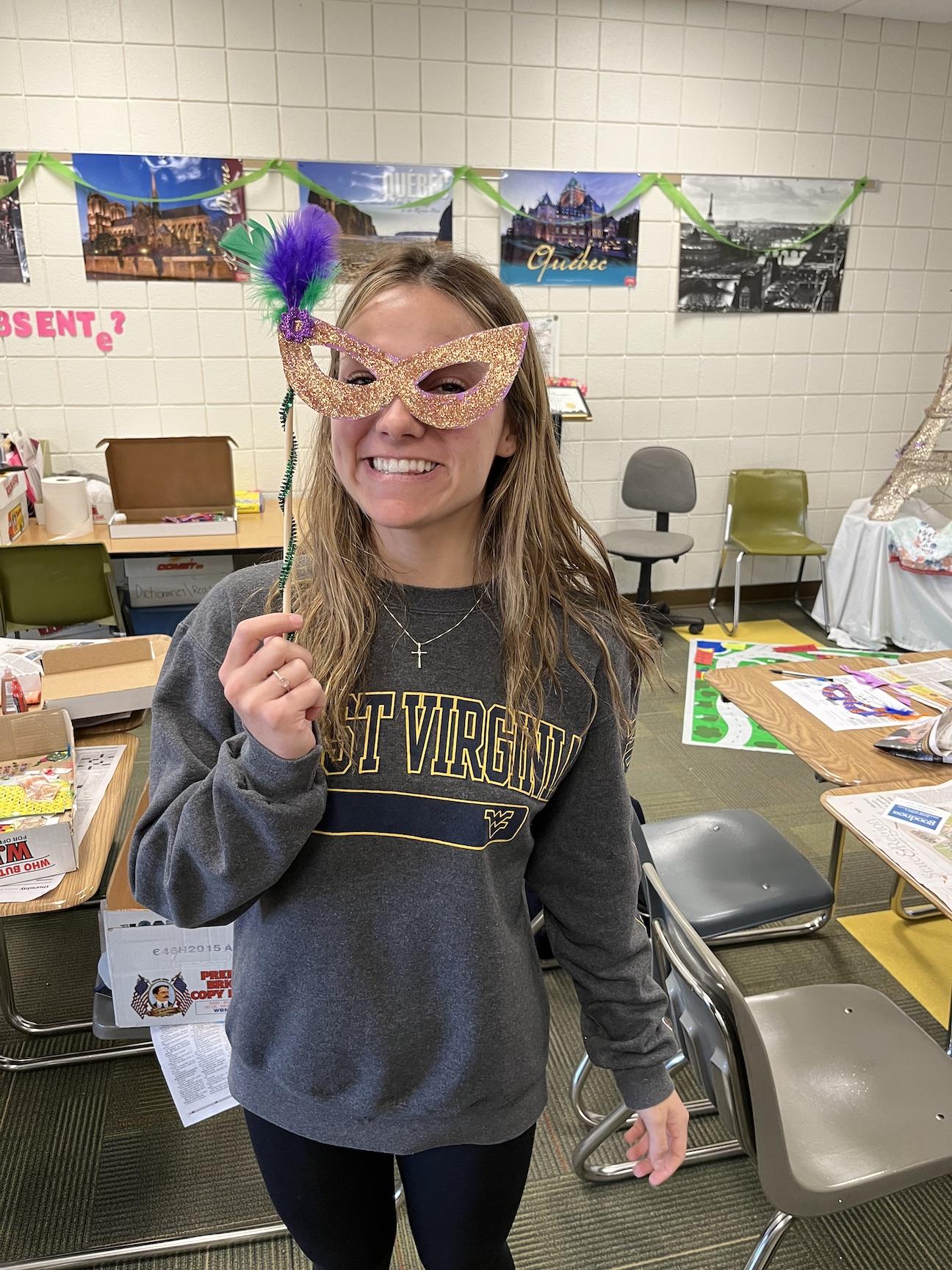 Carly Henderson shows the mask she created