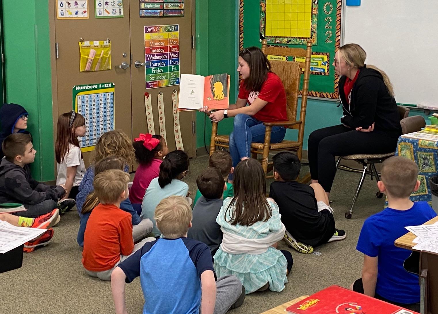 student reading to the elementary class