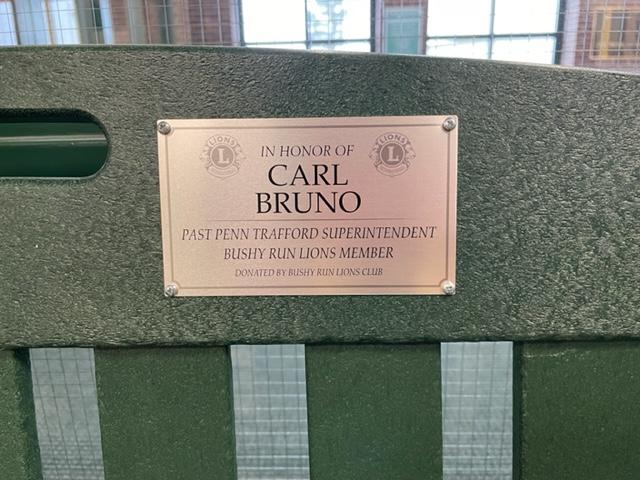A commemorative plaque honors the late Carl Bruno