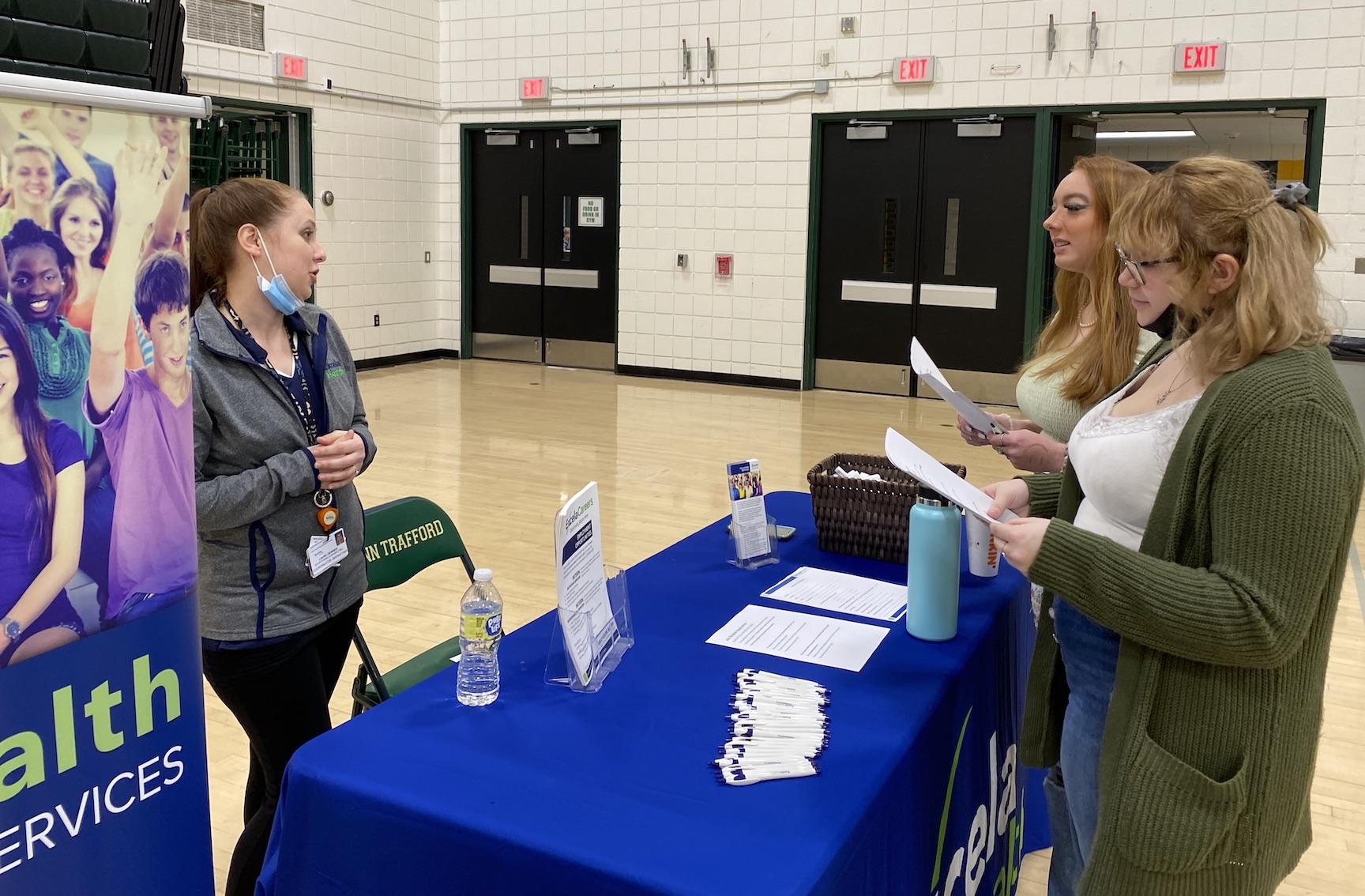 Aubrielle Eliyas and Lera Murphy learn about volunteering opportunities at Excela Health