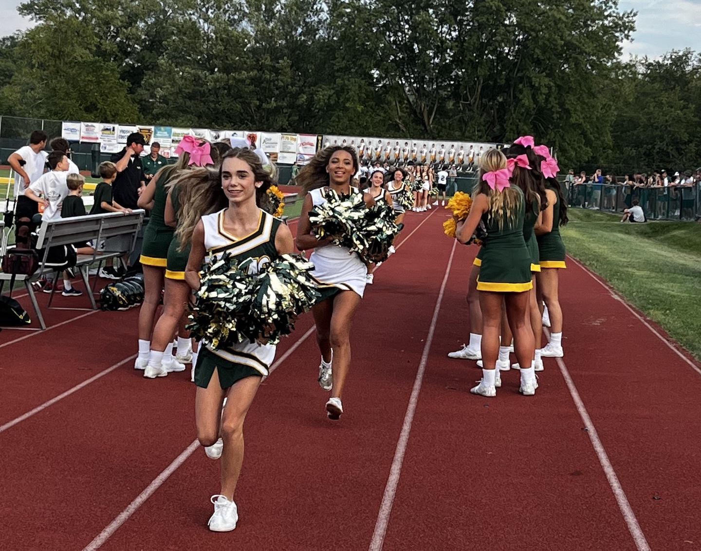 The middle school cheerleaders are introduced