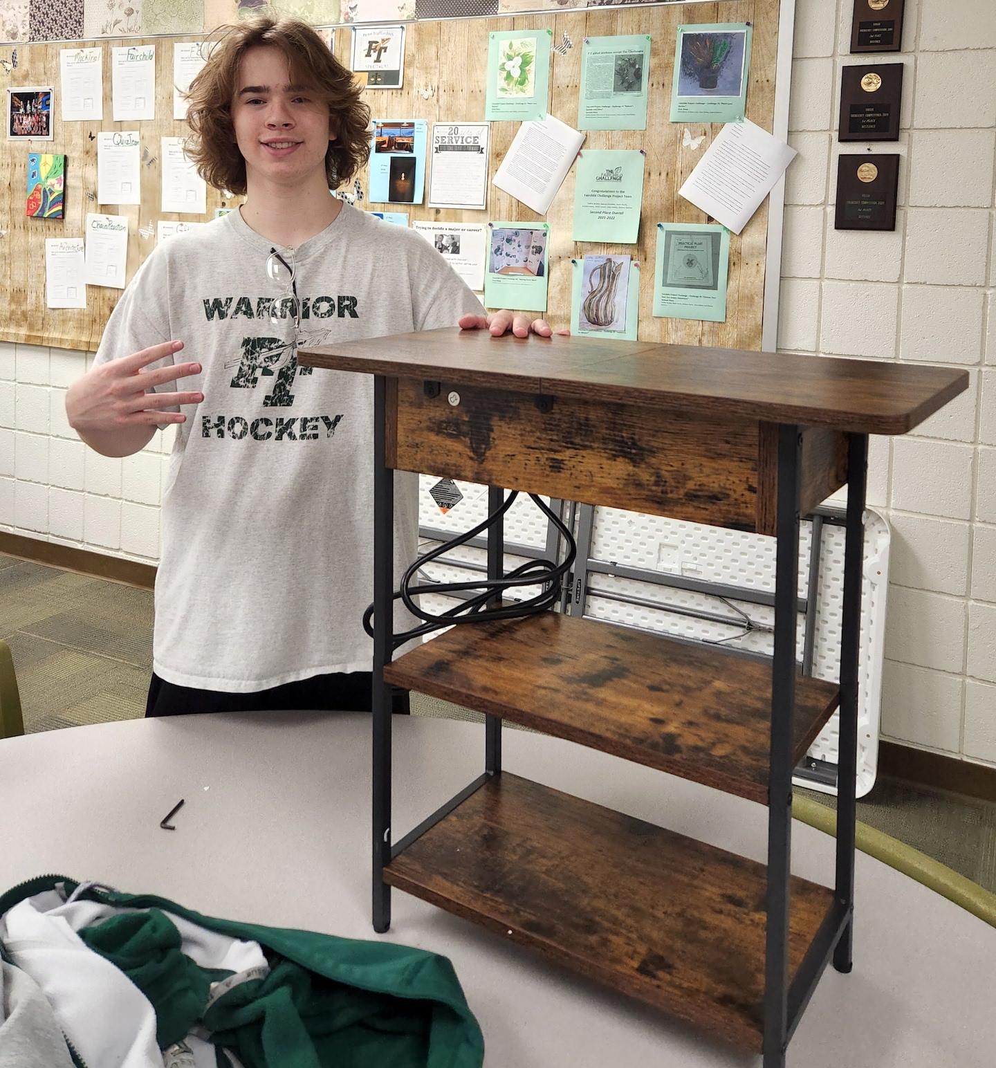 Landon Doonan helped to assemble a new table for the reading space