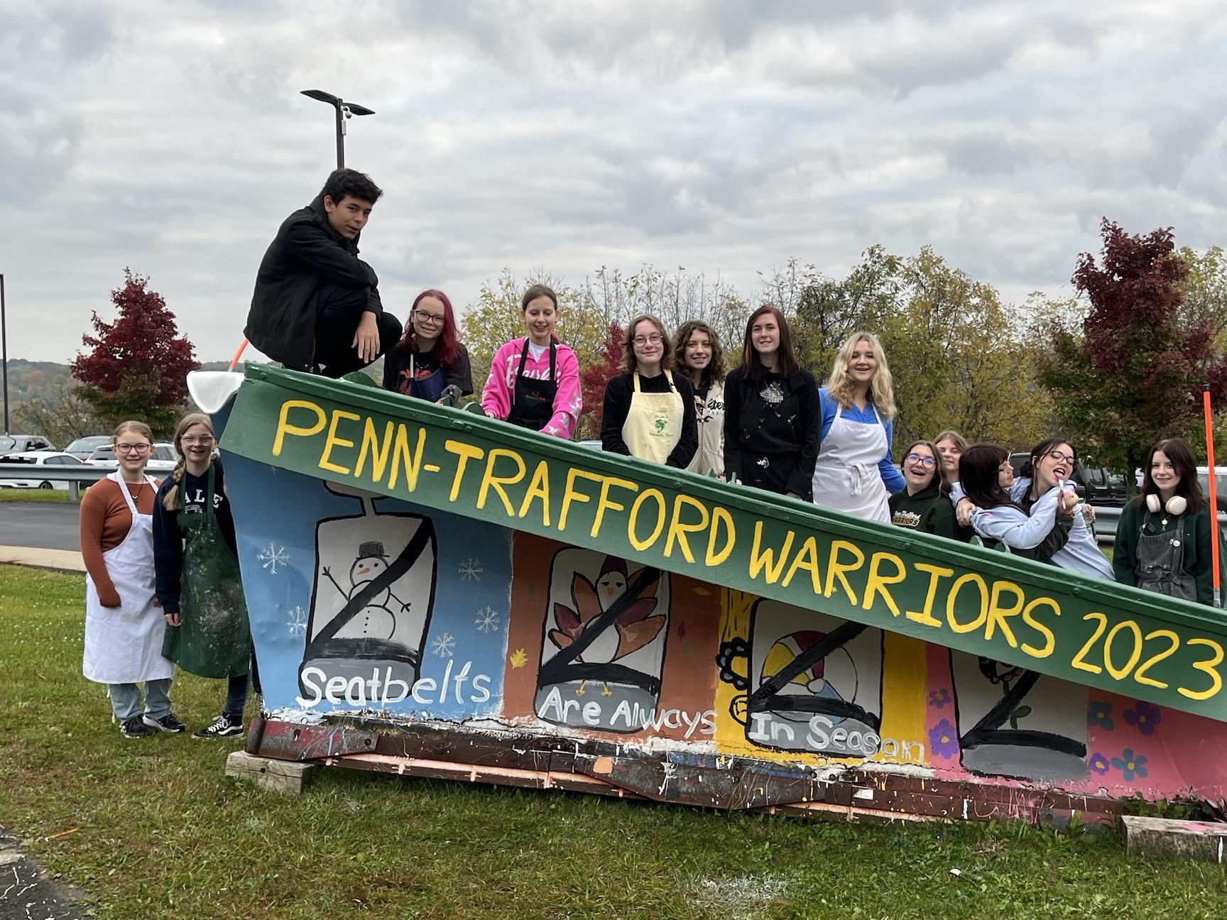 students pose with the painted plow