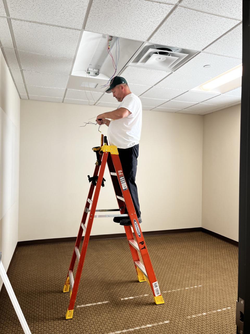 Bill Csaszar of the PT Maintenance team was tasked with installing efficient LED lighting throughout the new building