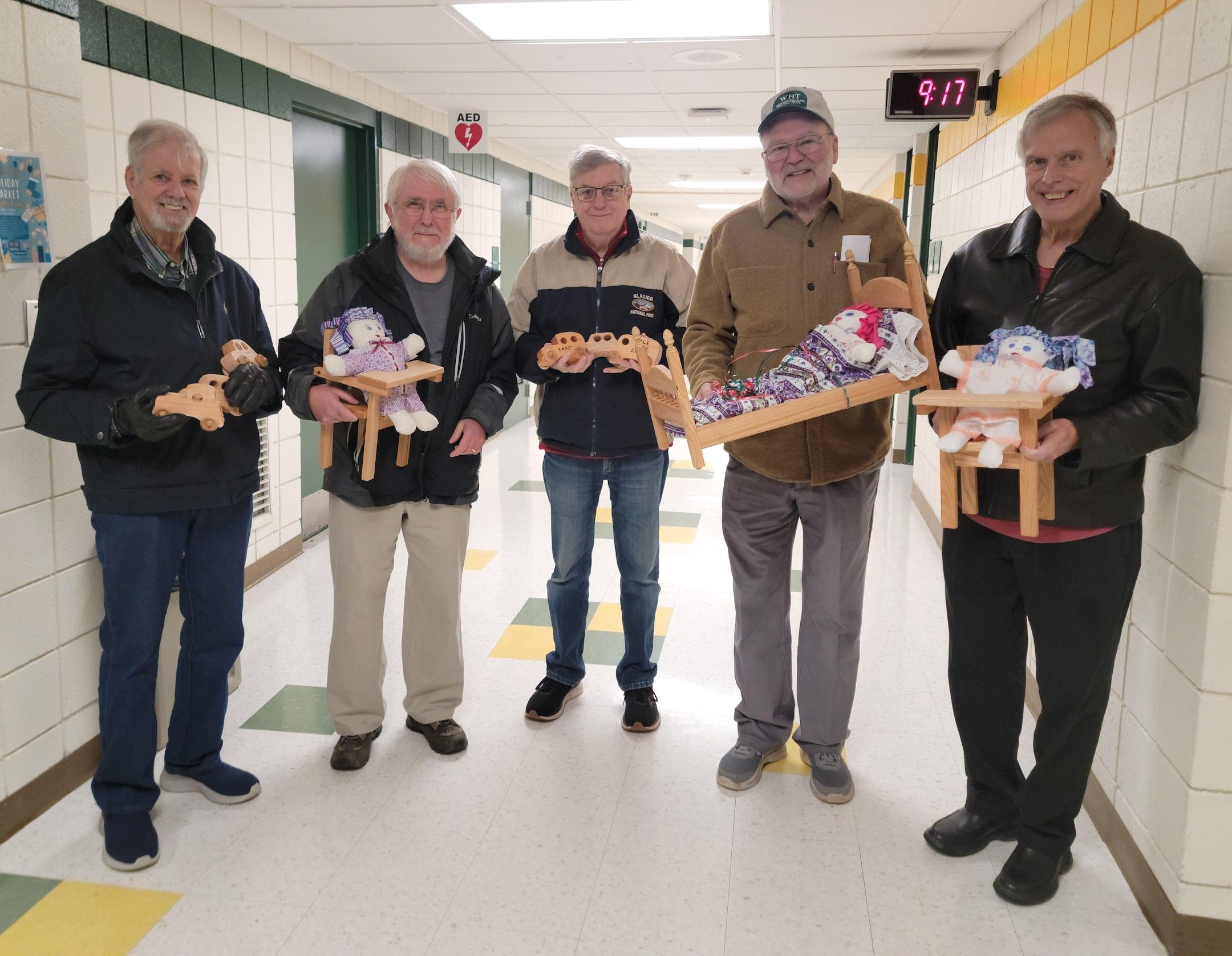 The Wood Chippers donated many handmade, wooden toys:  (left to right) Joseph Merante, Ron Shiner, Mike Hermsen, Stan Rudge, and Jim Costlow